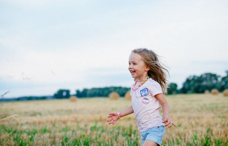Young girl running in the field