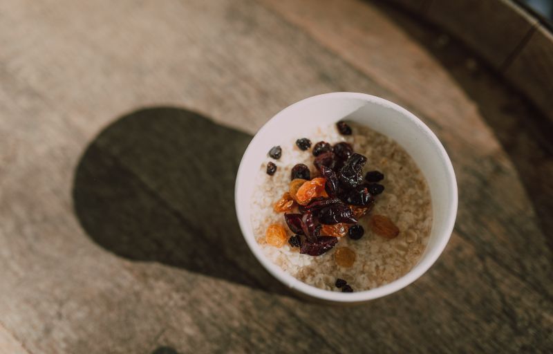 A bowl of oatmeal with dates and cinnamon is a healthy way to start your day, even if you're feeling nauseous.