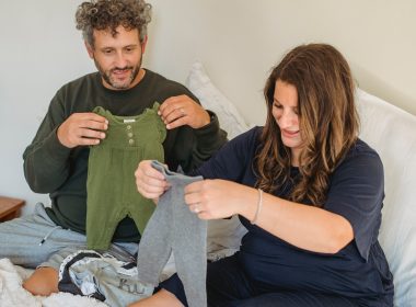 mom and dad preparing clothes for baby