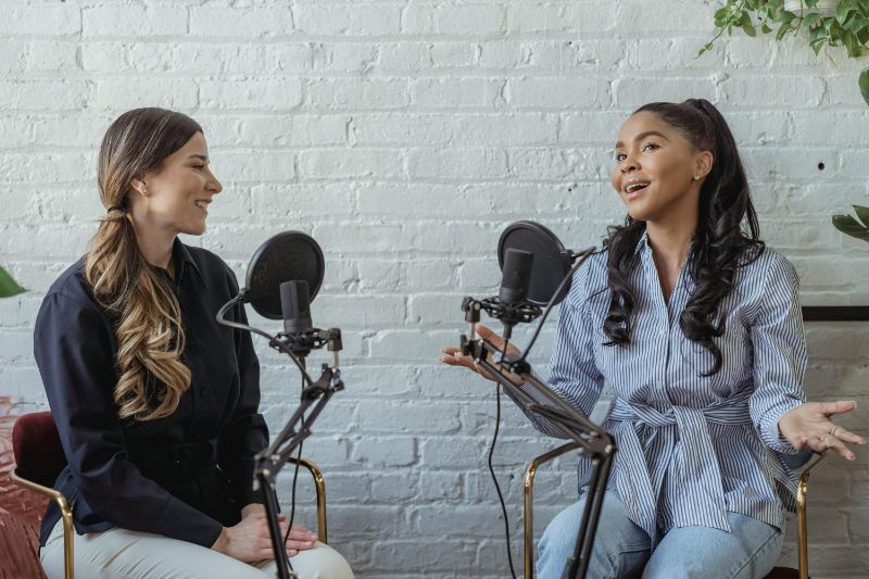 two women on a podcast
