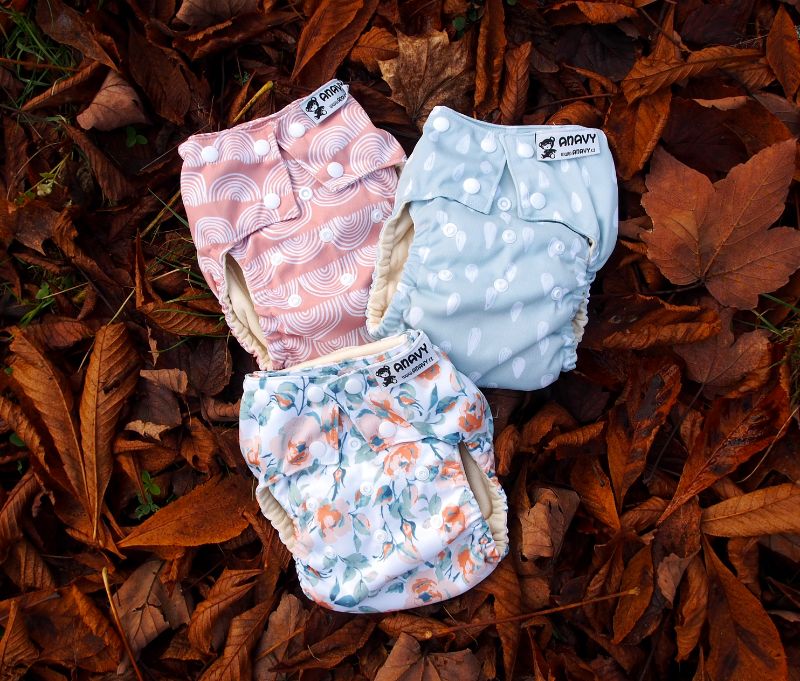 cloth diapers lying on brown leaves