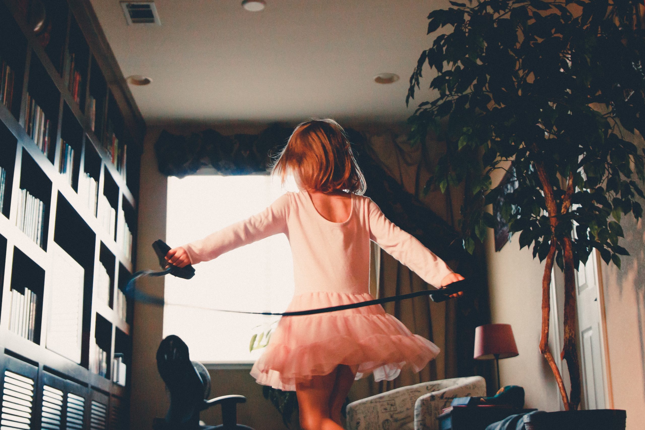 little girl running around the house 
