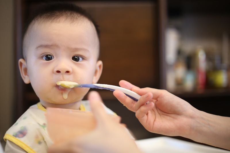 baby eating solid food