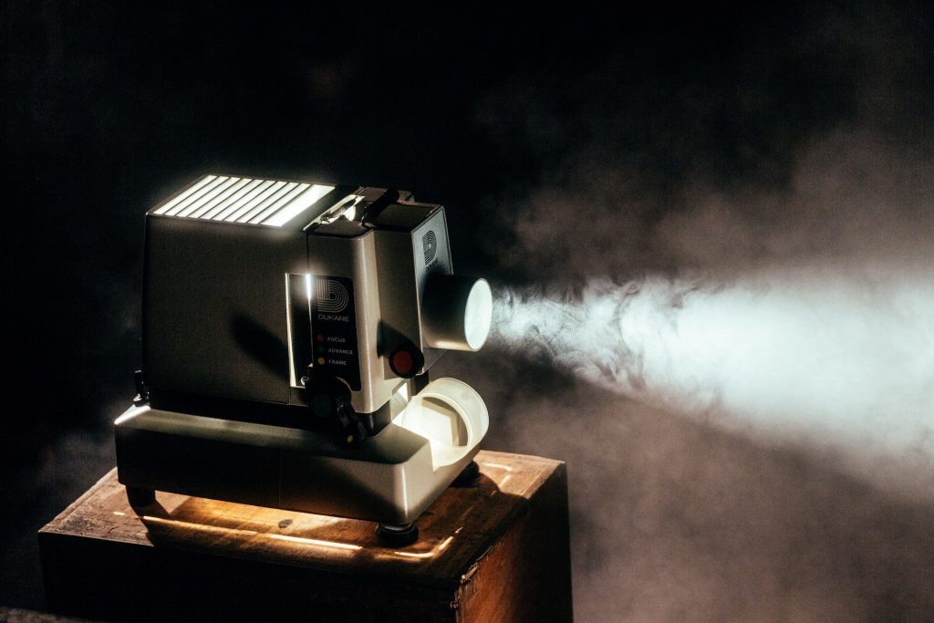 A movie projector shows a film