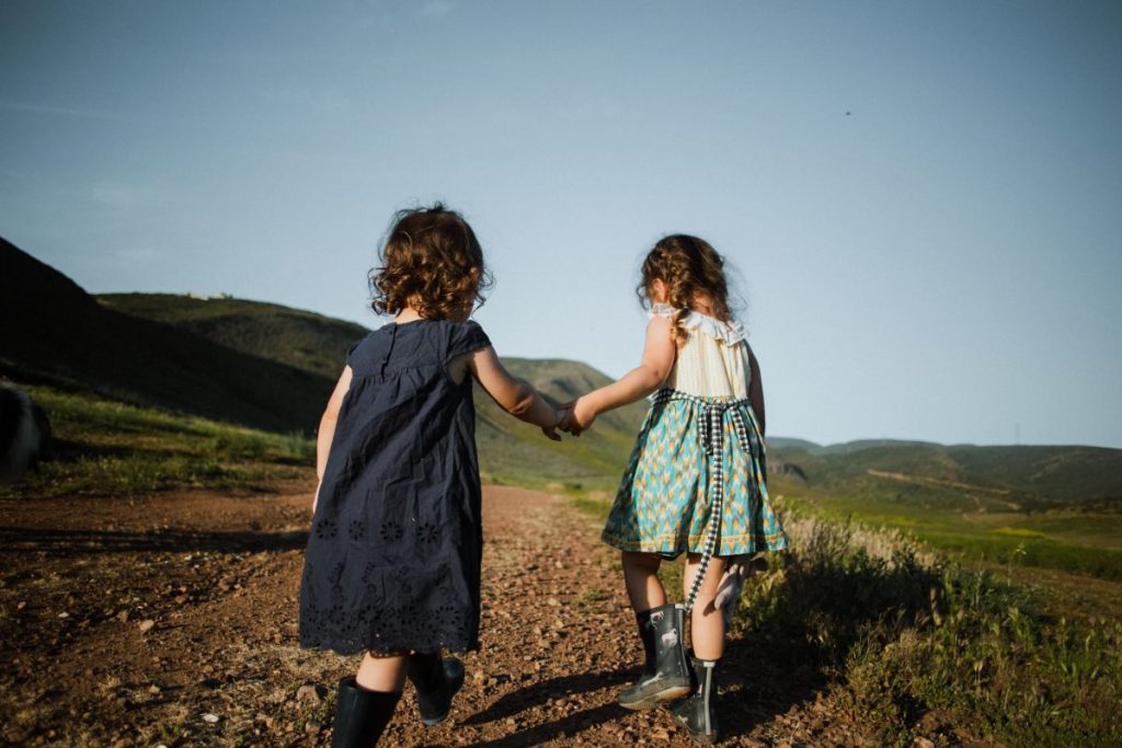 two girls walking in nature