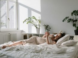Pregnant Woman laying in bed relaxing