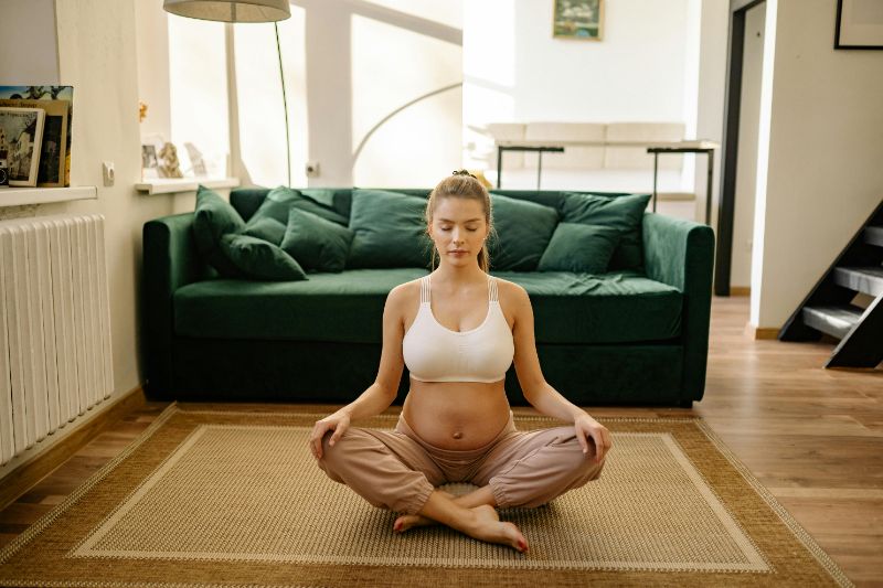 a pregnant woman doing yoga