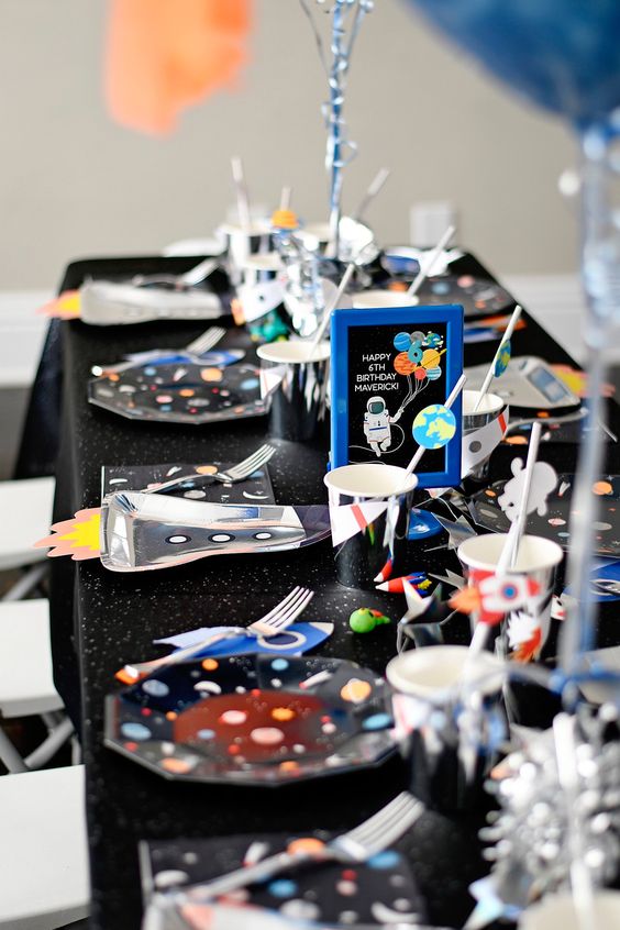 Outer-space-themed table set-up for kids.
