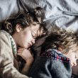 Two children sleeping beside each other